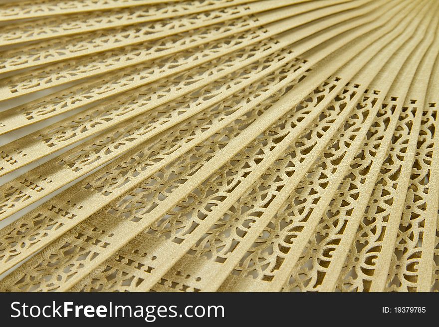 Wooden hand fan background with repeating pattern