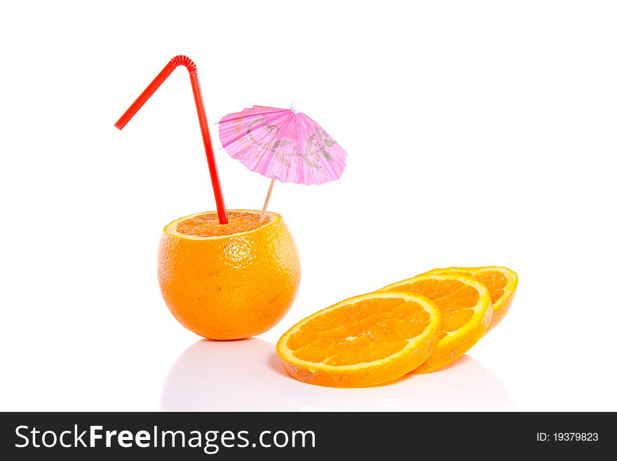 An orange with a straw and parasol isolated over white background