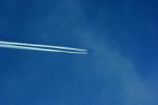 Jet Plane With Trace In The Sky Royalty Free Stock Photography