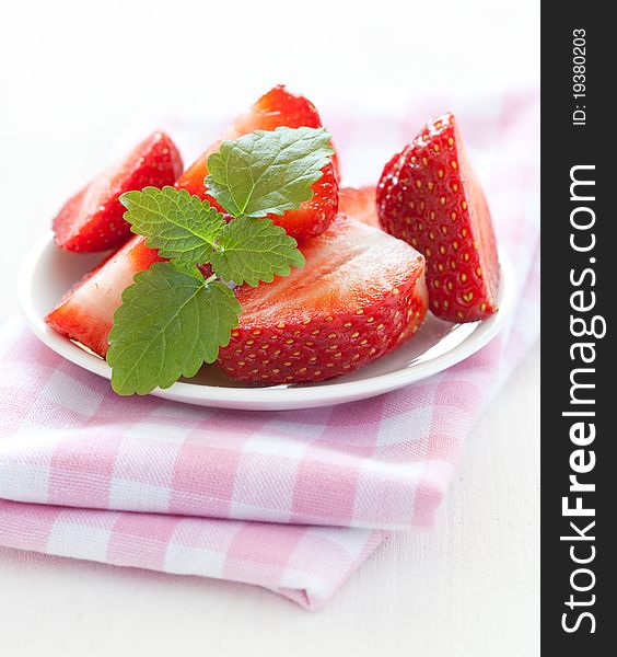 Fresh sliced strawberries with mint. Fresh sliced strawberries with mint