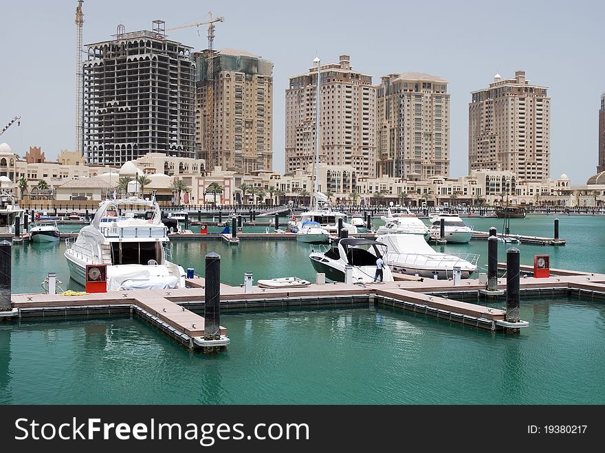 Yachts and boats docked at the Pearl, Qatar. Yachts and boats docked at the Pearl, Qatar