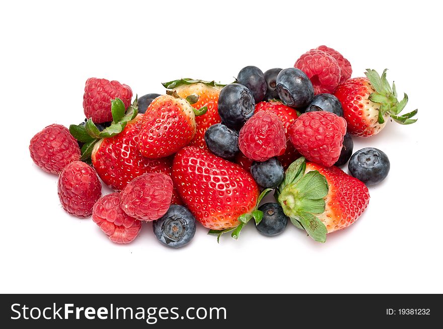 Raspberries,strawberries and blueberries over white background