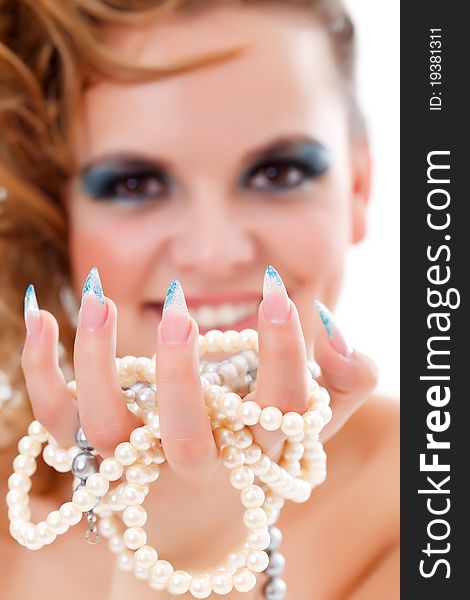 Fashion woman wearing long nails, having jewelery in her hand. Fashion woman wearing long nails, having jewelery in her hand