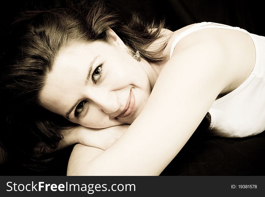 Attractive beauty woman smiling on a black background. Attractive beauty woman smiling on a black background