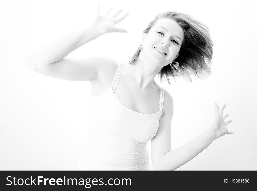Beautiful girl in dress dancing on a white background. Beautiful girl in dress dancing on a white background