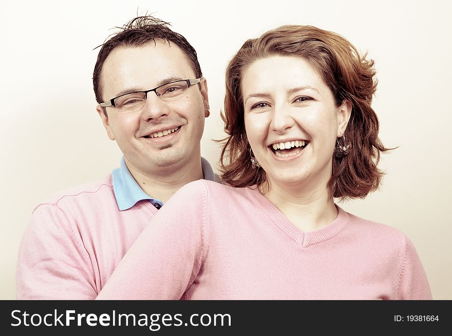 Young Beautiful Happy Couple Smiling in the Engagement Day in a tender moment