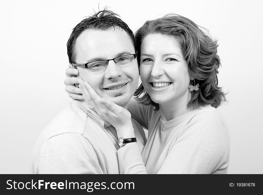 Young Beautiful Happy Couple Smiling in the Engagement Day in a tender moment