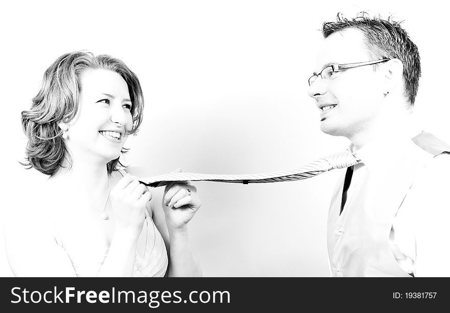 Young Beautiful Happy Couple Playing with the Tie