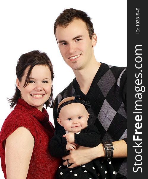 Couple holding their baby girl posing for a portrait