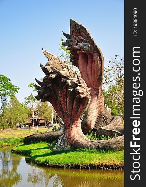 The king of Naga Statue is a stone sclupture of 5 heads snake -- thailand