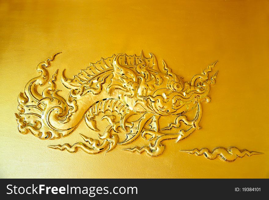 The wall sculpture of the golden fish