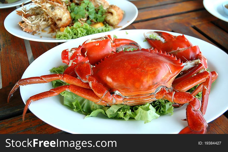 Cooked crabs on white plate