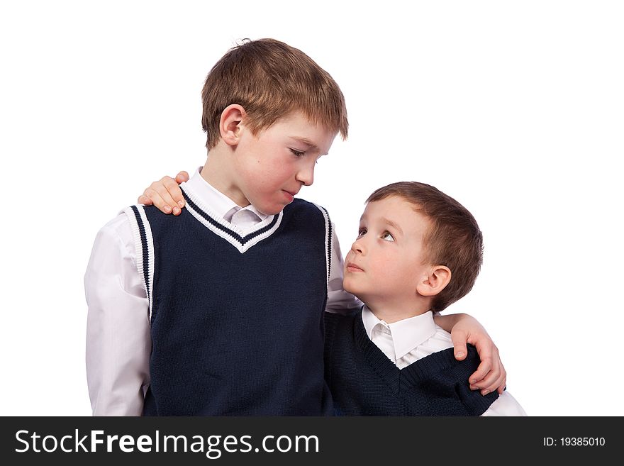 Portrait of two brothers in school uniform, isolation
