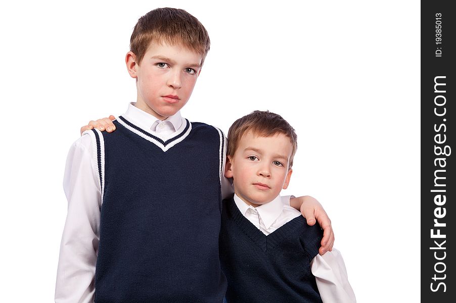 Portrait of two brothers in school uniform, isolation