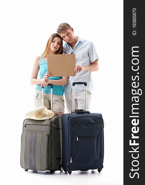 Tired couple with suitcases and an empty plate isolated. Tired couple with suitcases and an empty plate isolated