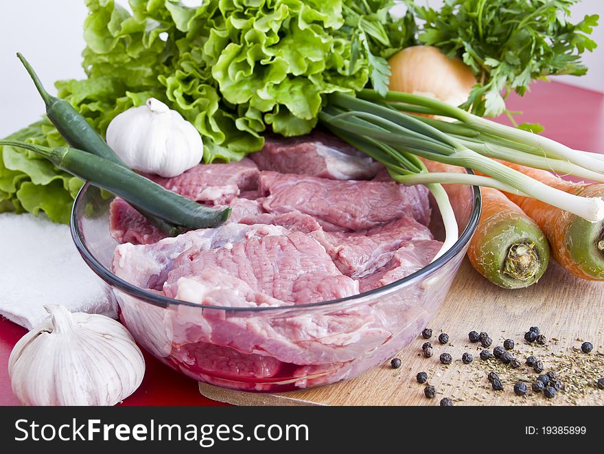 Beef meat on table and vegetables