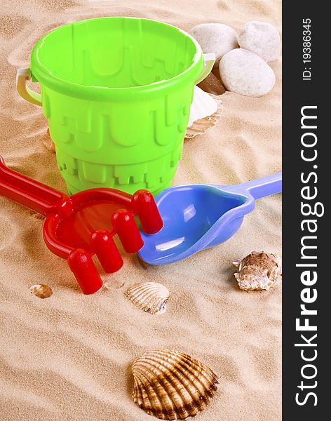 Children's toys - bucket, spade and shovel on sand. Children's toys - bucket, spade and shovel on sand