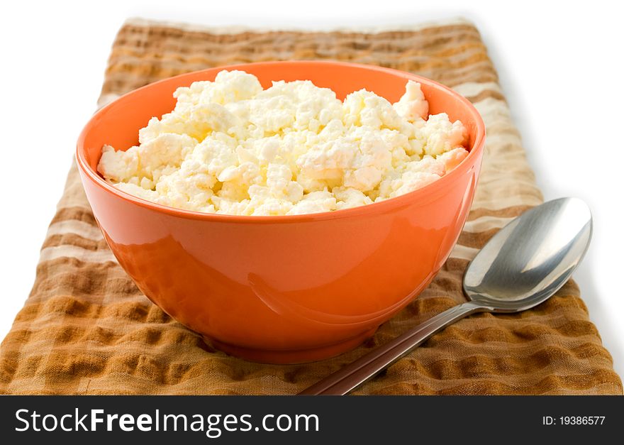 Cottage cheese in a bowl on a white background