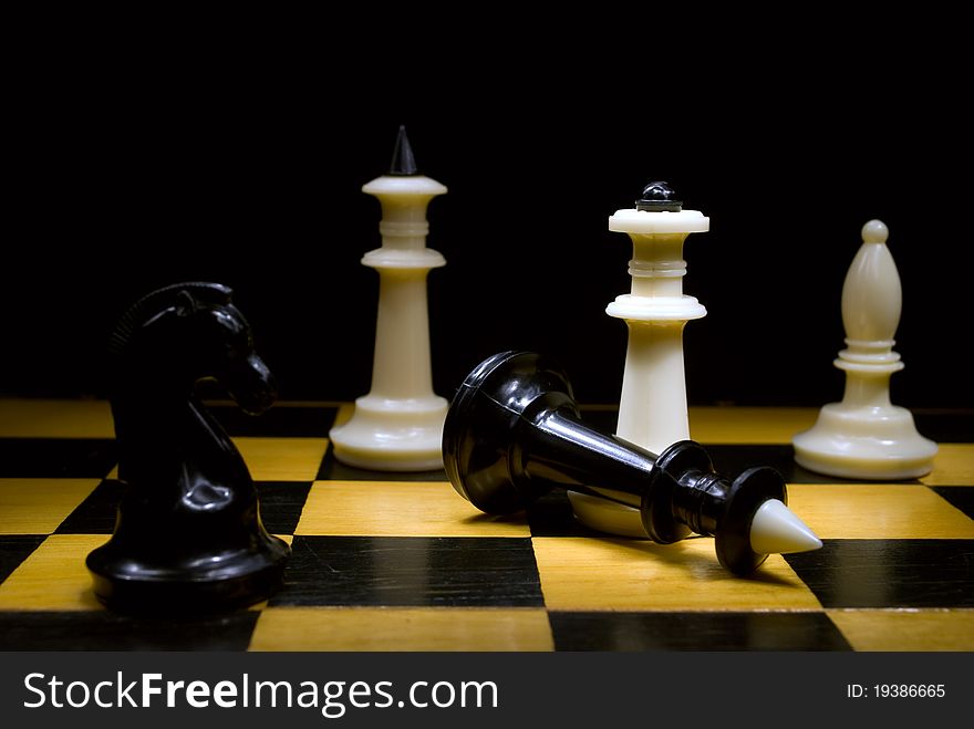 Chess pieces on a chessboard, close-up