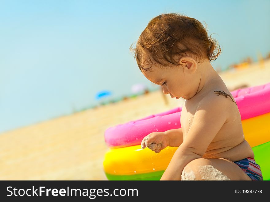 Little girl on the sand beach