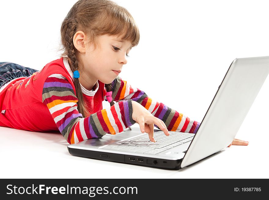 Portrait of a little girl with a laptop