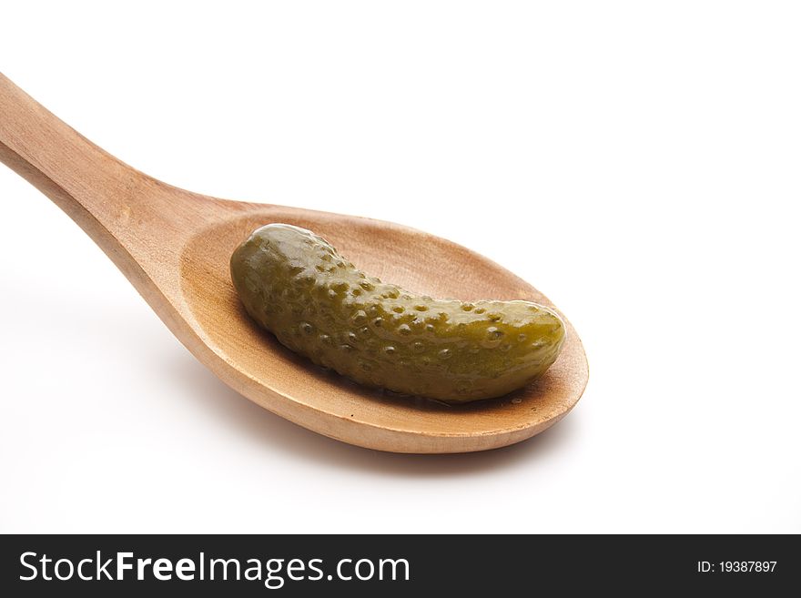 Gherkin on the cook spoon