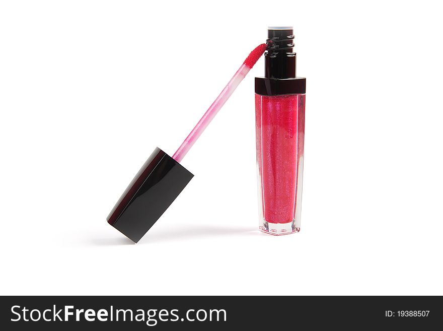 The open pink lip gloss.