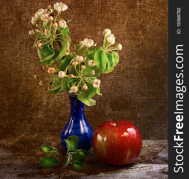 Still life with flowers and apple