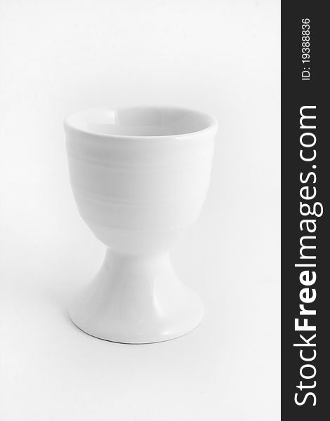 White egg cup isolated over white. White egg cup isolated over white