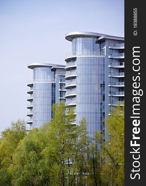 Modern building and green trees in Kiev.Ukraine. Modern building and green trees in Kiev.Ukraine
