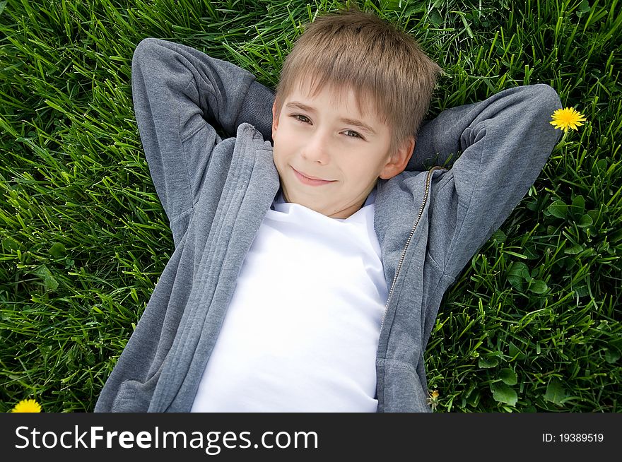 Boy on the green grass