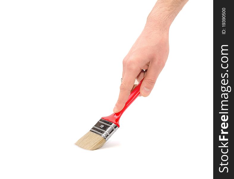 Human hand with a brush painting on a white background. Human hand with a brush painting on a white background