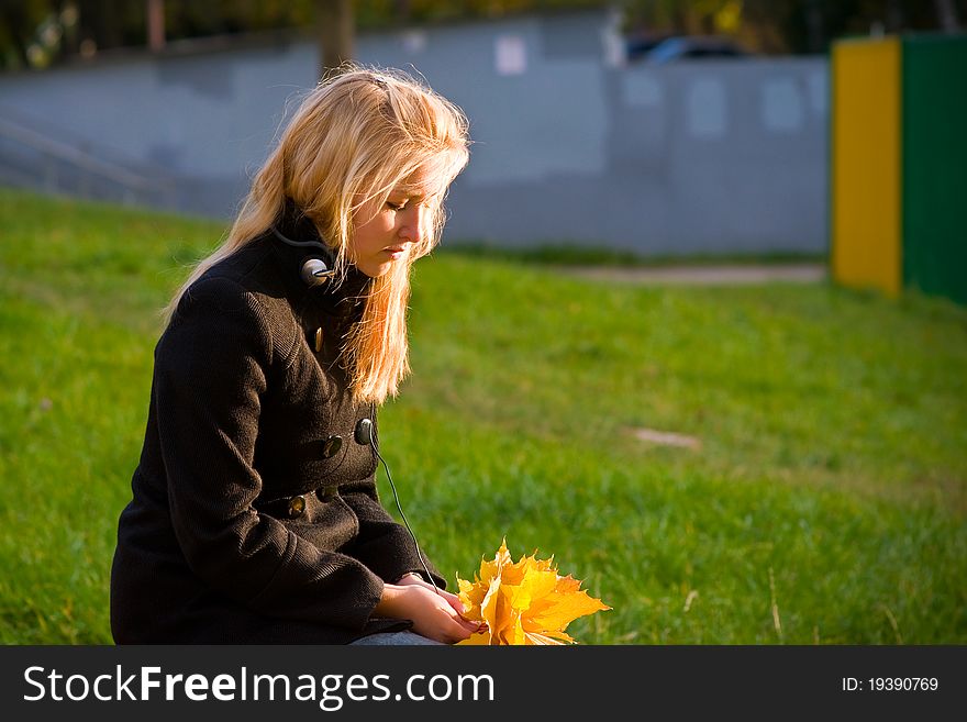 Girl with yellow leaves