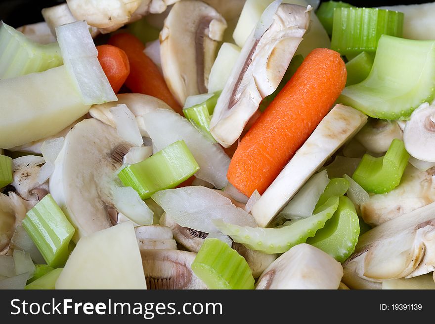 Fresh cut vegetables including carrots, celery, potatoes, mushrooms, and onions. Fresh cut vegetables including carrots, celery, potatoes, mushrooms, and onions.