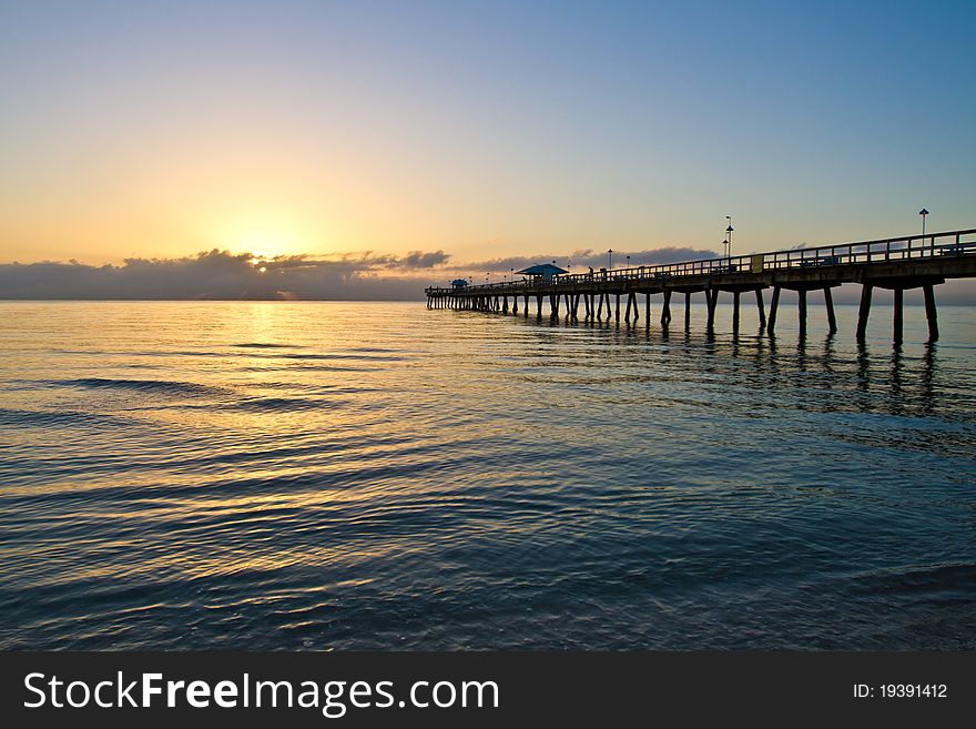 Sunrise in Fort Lauderdale, Florida over Commercial Pier. Sunrise in Fort Lauderdale, Florida over Commercial Pier.