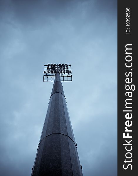 Stadium light pole on a cloudy evening