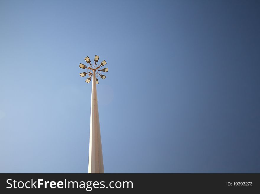 Street lighting large pole light blue sky