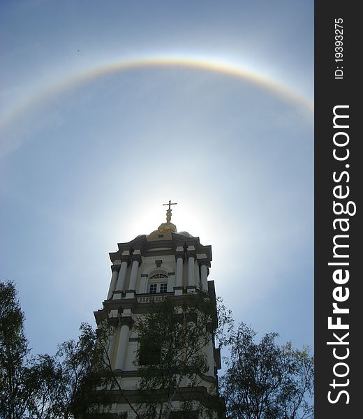 Rainbow around sun behind the Pochayiv Lavra