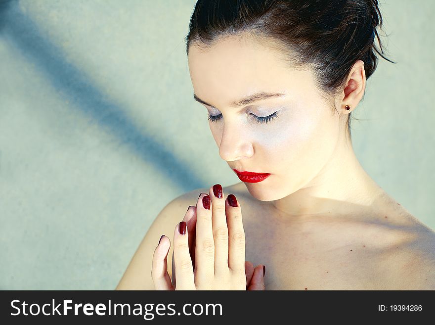 Beautiful girl with red lips consecrated hands. Beautiful girl with red lips consecrated hands