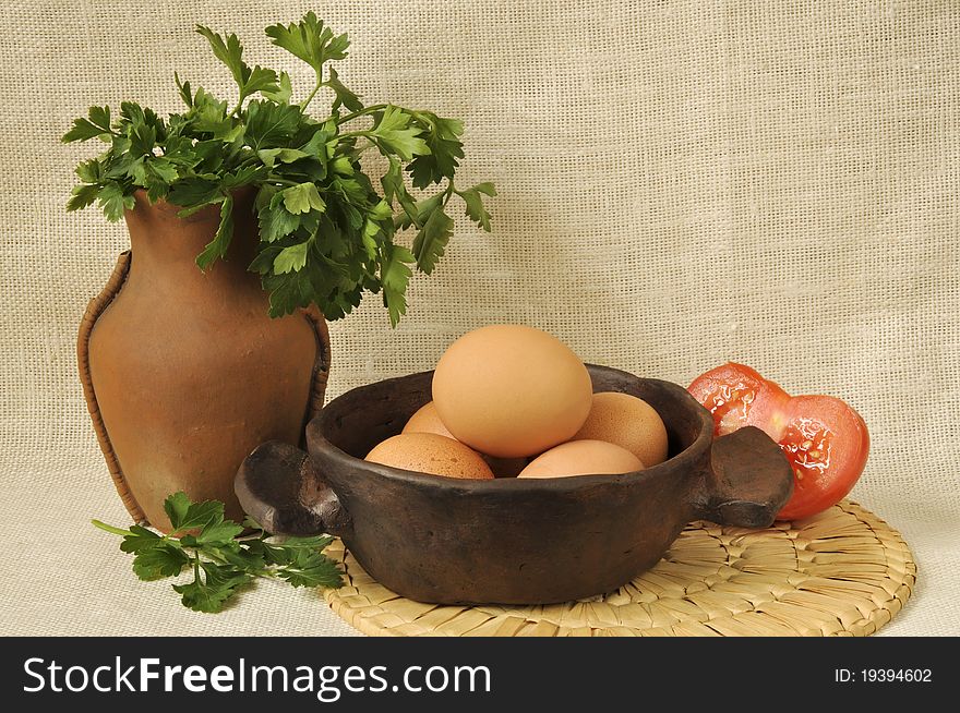 Eggs, tomatoes, parsley and old ceramic ware. Eggs, tomatoes, parsley and old ceramic ware