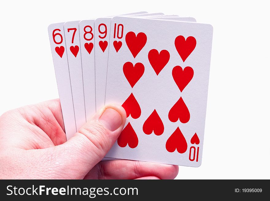 Hand holding straight flush in hearts