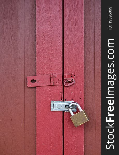 Red wooden door with lock. Red wooden door with lock