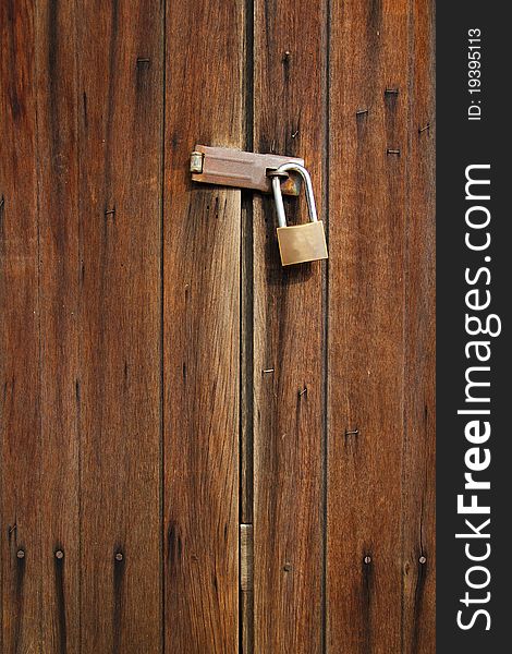 Brown wooden door with lock. Brown wooden door with lock