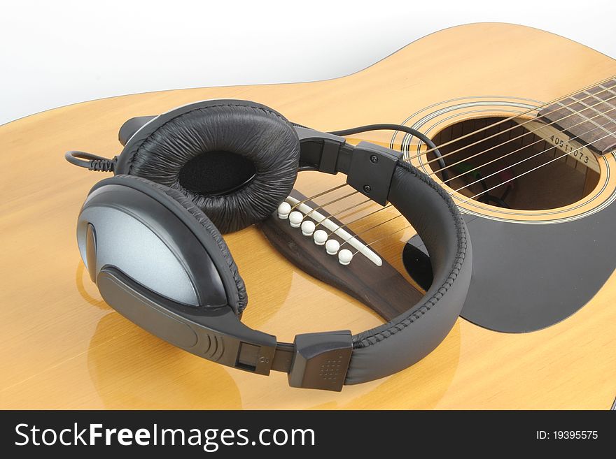 Headphone on guitar for leisure time