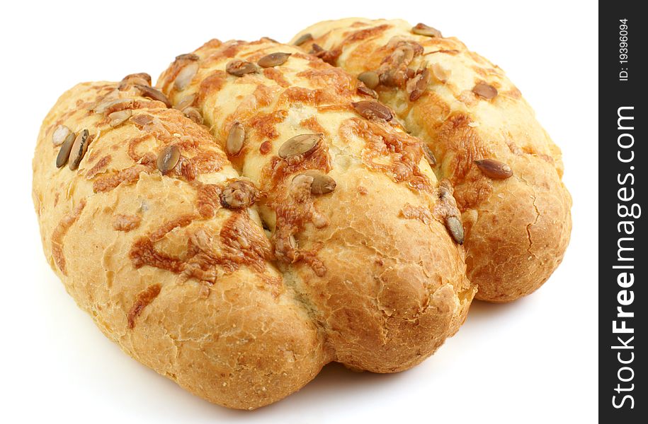 Loaf of corn bread with pumpkin seeds on white background. Loaf of corn bread with pumpkin seeds on white background