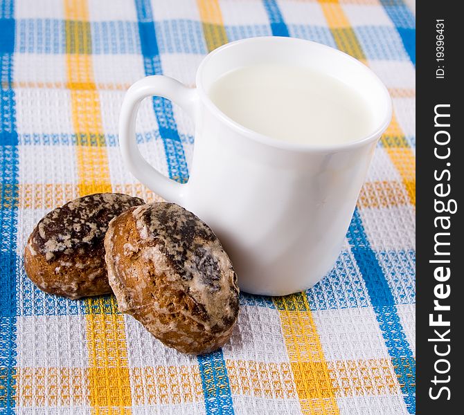 Milk and chocolate cakes on a checkered napkin