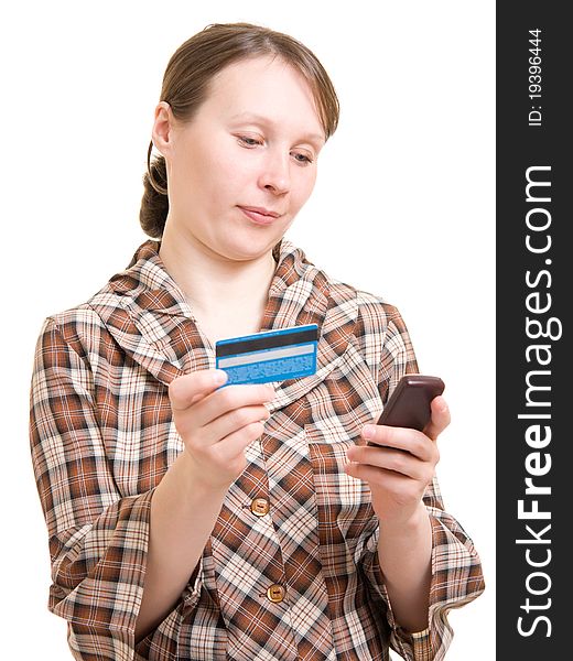 Girl with a phone and a debit card. Girl with a phone and a debit card