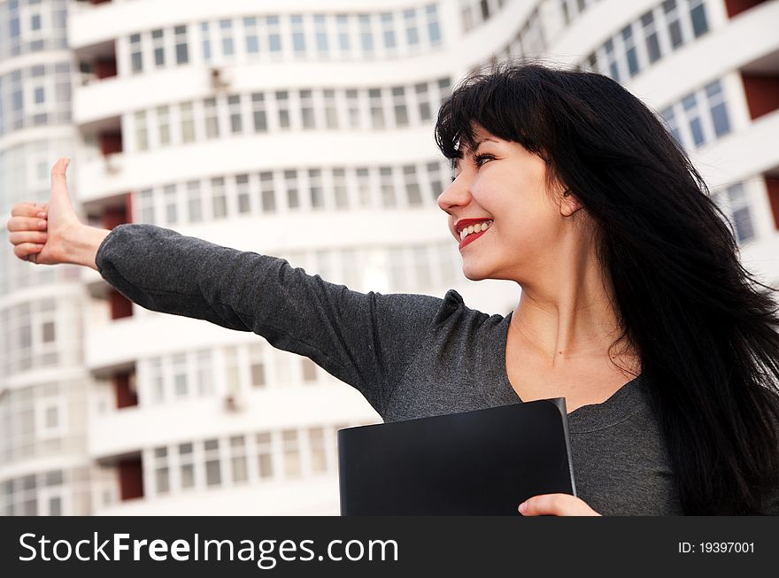 Young business woman at building