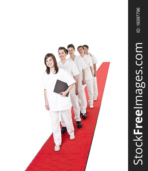 Medical Team on a red Carpet isolated on white background