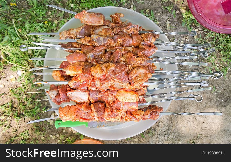 Raw kebab on the dish for preparing outdoors. Raw kebab on the dish for preparing outdoors.